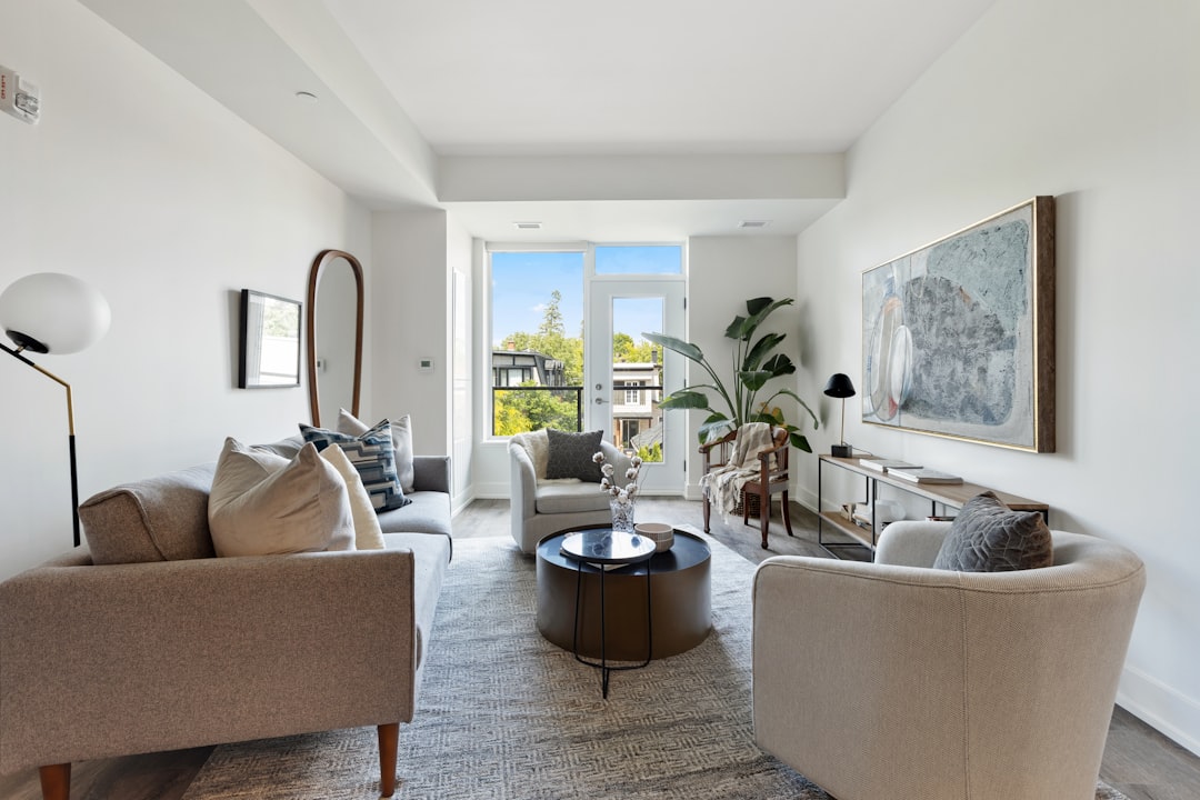 A family enjoying time together in a comfortable, sunlit living room, illustrating the health and comfort benefits of a well-insulated home.